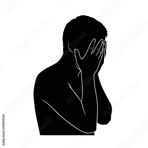 Silhouette of a Man Covering Face in Distress