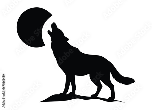 Silhouette of a wolf howling at the moon on a rocky outcrop