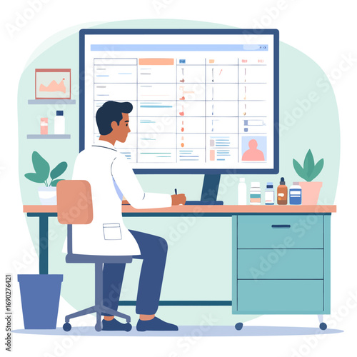 Male Doctor in White Coat Working at His Desk with a Computer.