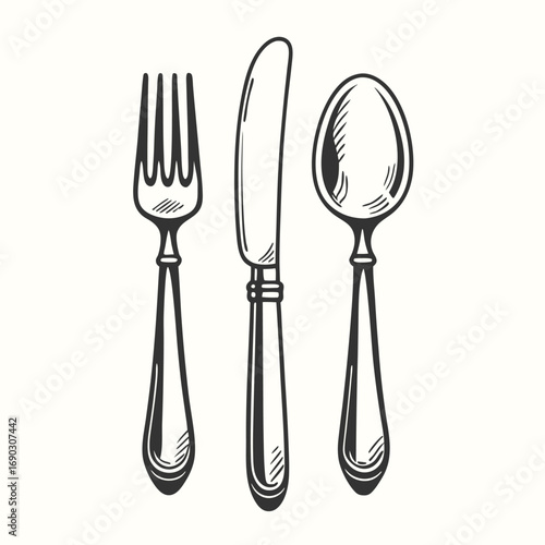 Antique cutlery set featuring a fork, knife, and spoon displays intricate craftsmanship nicely