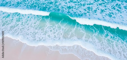 Azure ocean waves crash on white sand, seen from a drone's perspective,  landscape,  relaxing