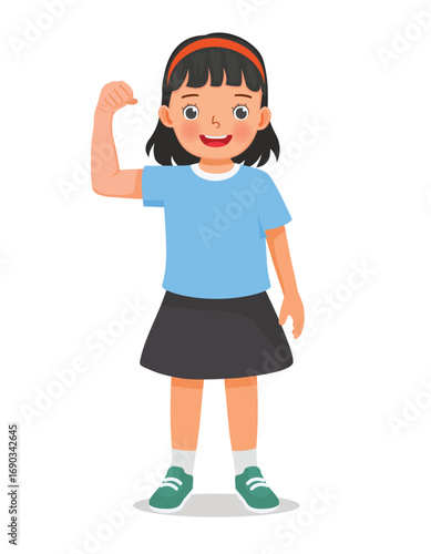 Little girl showing her strong muscle arm fist
