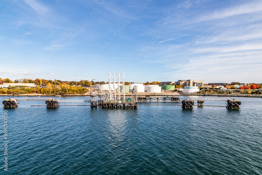 view to skyline of Groton from the seaside with view to industrial area with tank farm view to skyline of Groton from the seaside with view to industrial area with tank farm