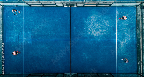 Aerial view of practice people at the blue paddle tennis courts