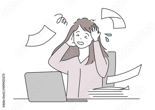 パソコンの前で頭を抱えて困っている女性　仕事　ビジネス