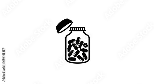An open bottle filled with numerous dark capsules, suggesting medication or supplements.
