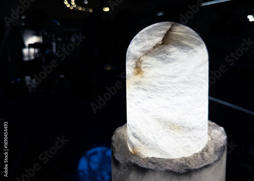 Natural solid stone table lamp in dark light.