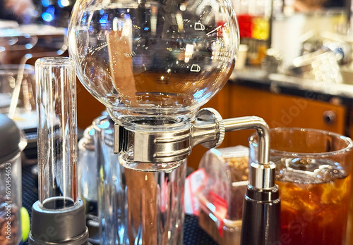 Stainless steel clamp with round bottom flask.	