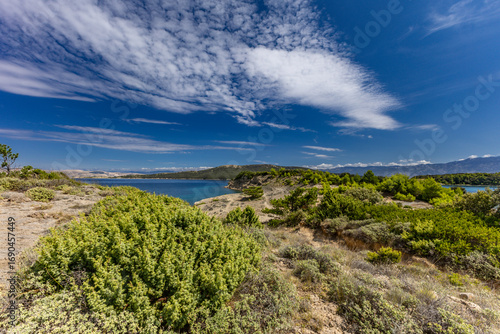 Photos Azure water in the Adriatic Sea, rocky coast of the island of Rab, cloudy, threa