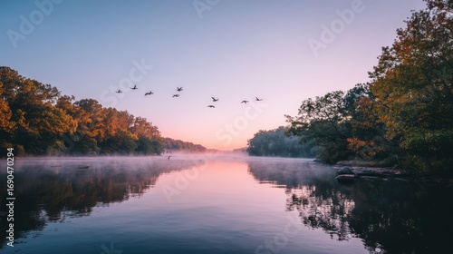 Serene Early Morning River Scene with Mist and Flying Birds in Natural Setting