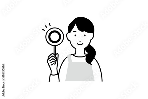 正解の札を持った料理をするエプロンを着た女性の人物イラスト モノクロ 1色