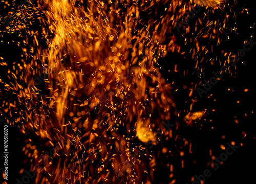 A black background with a lot of orange sparks