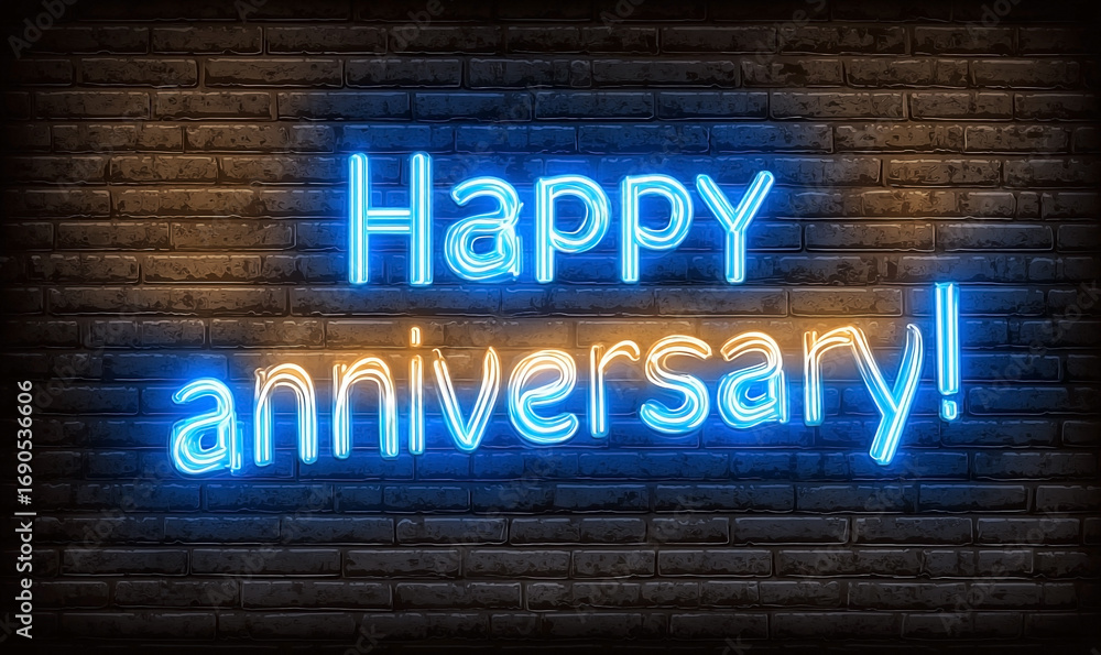 Fototapeta premium Vibrant Neon Happy Anniversary Sign on Brick Wall.