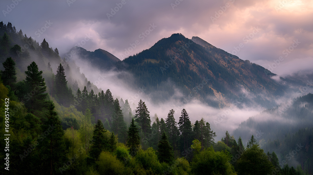 Obraz premium Fog rolling over majestic mountain peaks and lush green forest