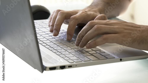 typing on laptop