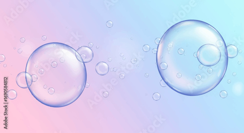 Transparent soap bubbles floating on a soft pink and blue pastel gradient background.