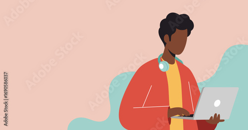 Young Black man with headphones around his neck working on a laptop computer with a minimalist abstract background, representing modern lifestyle and technology.