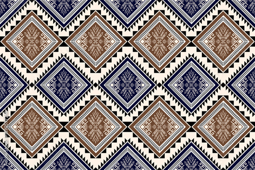 Seamless bohemian-style geometric diamond pattern arranged in a zigzag layout, featuring prominent tones of blue and earthy brown, giving a woven textile feel.