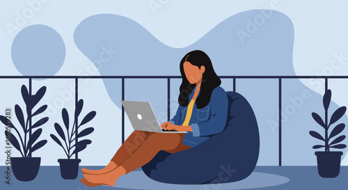 Woman working remotely on a laptop, comfortably seated on a bean bag on a modern balcony with potted plants. Represents flexible work, freelance, or online learning lifestyle.