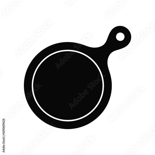 Simple black silhouette of a round cutting board with handle