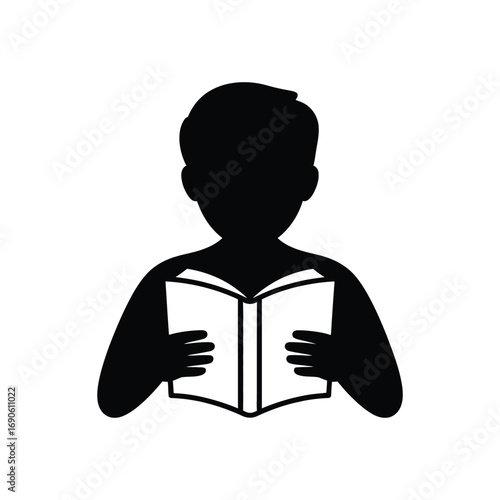 Silhouette of a person reading an open book
