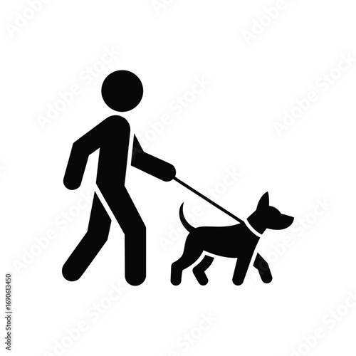 Silhouette of a person walking a dog on a leash