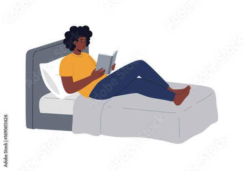 Woman Reading a Book in Bed Relaxing at Home.