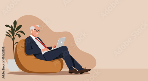 Senior businessman smiles, working comfortably on a laptop from a bean bag in a modern, relaxed office. Ideal for remote work, senior professionals, and flexible lifestyle concepts.