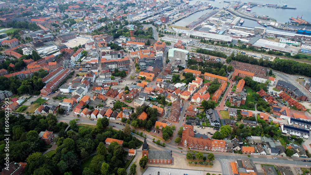 Fototapeta premium Aerial panorama of the downtown of the city Cuxhaven in Germany on a cloudy summer afternoon.