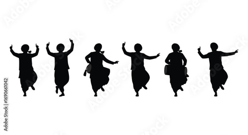 dancers performing traditional moves gracefully in silhouette form