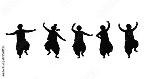 silhouettes of dancers performing traditional dance movements gracefully
