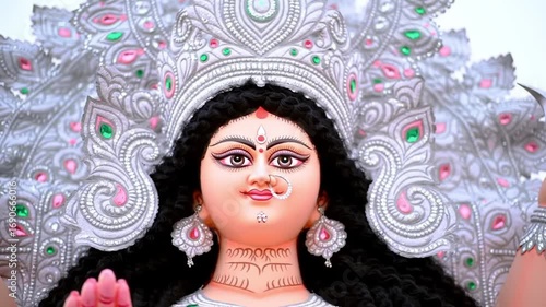 Close-up of a colorful Durga Puja idol with intricate designs and traditional Indian attire