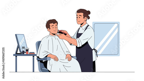 Professional barber in apron carefully trimming a young man s beard with electric trimmer in a modern salon