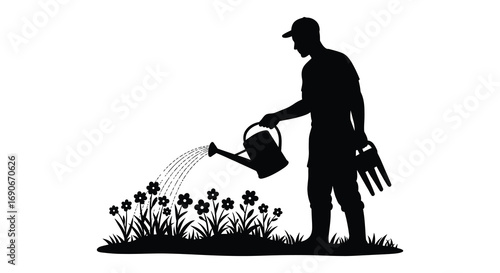 gardener watering flowers with care using a metal can