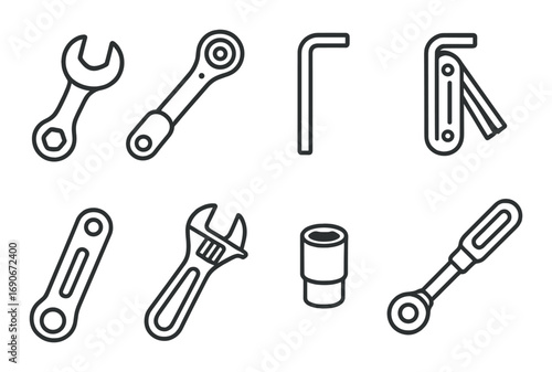 Set of various hand tools including wrench, ratchet, and hex key on dark background