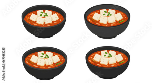 Four black bowls of spicy tofu soup.