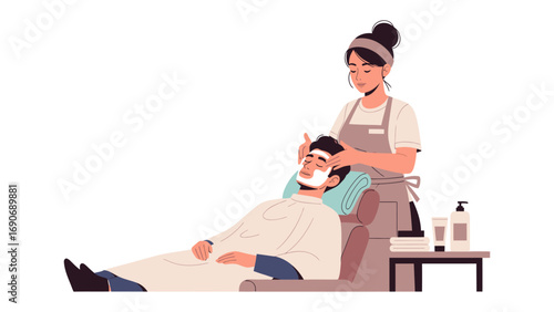 Skilled female barber applying shaving cream to a male client s face in a modern salon setting