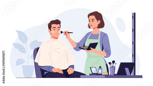 Professional makeup artist applying foundation to a male client in a salon or studio setting with tools and mirror