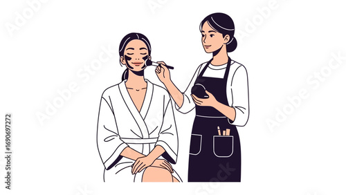 Professional makeup artist applying cosmetics to a woman wearing a white robe in a beauty salon setting