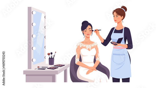 Professional makeup artist applying makeup to a bride in a white wedding dress in front of a lighted vanity mirror