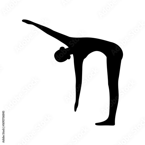 Silhouette of a woman doing a standing forward bend yoga pose