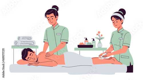 Two professional masseuses in uniform giving a relaxing full body massage to a contented male client on a massage table in a bright spa setting