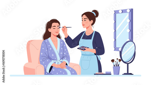 Young woman receiving makeup application from a professional makeup artist in a beauty salon or home setting