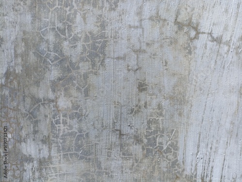 Cracked Concrete Wall Texture. Close-up of cracked concrete wall surface with subtle lines and rough patterns, ideal for abstract backgrounds and grunge designs