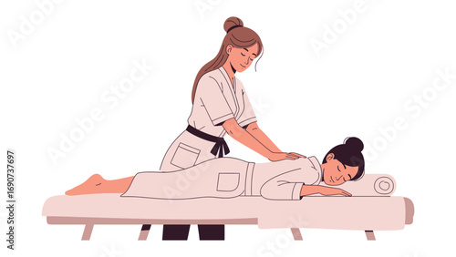 Skilled masseuse gently massaging the back of a relaxed woman lying on a massage table in a spa setting