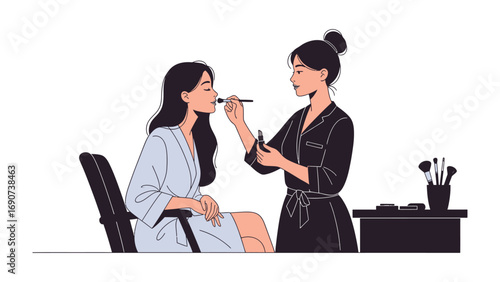 Young woman receiving professional makeup application from a skilled artist in a salon setting with beauty tools