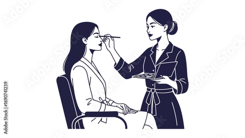 Professional makeup artist applying cosmetic makeup to a young woman s face with a brush in a studio setting