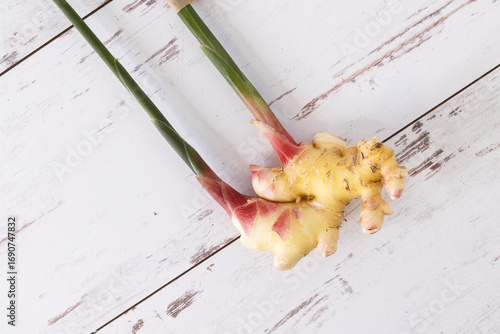 Fresh ginger from farmers market with stems intact.