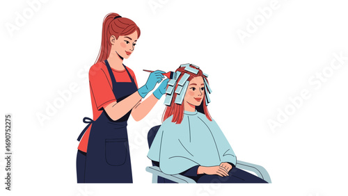 Professional hairstylist applying hair dye with foils to a client sitting in a salon chair receiving a color treatment
