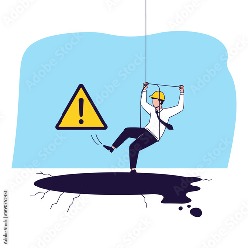 Worker in danger due to falling hazard while suspended on safety harness in hazardous environment